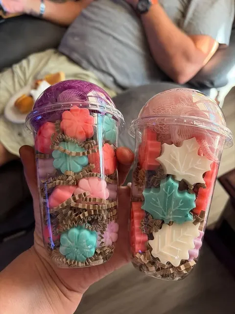 Katrinia’s soap cups filled with colorful flower and leaf shaped soaps.